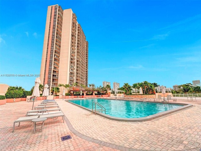 view of swimming pool with a patio area