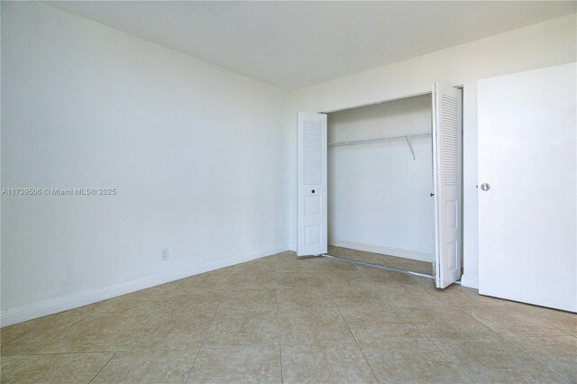 unfurnished bedroom featuring a closet