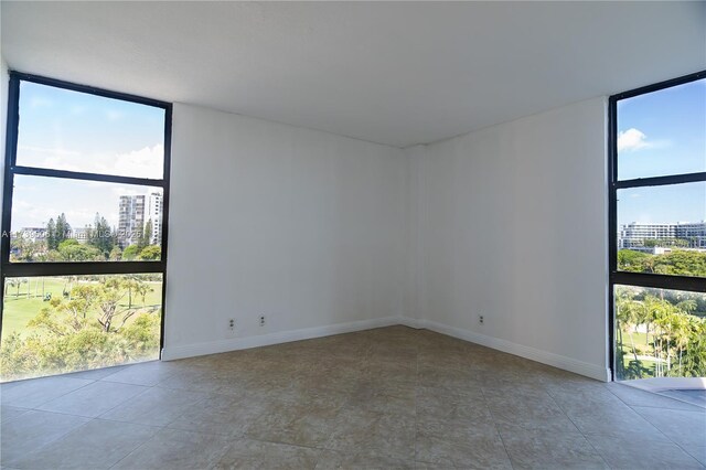 spare room featuring expansive windows