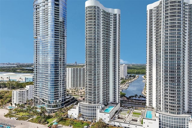 view of property with a view of city and a water view