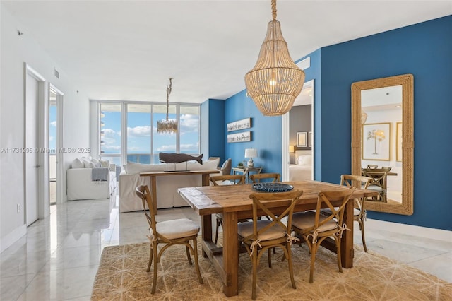 dining area with light tile patterned floors, floor to ceiling windows, visible vents, and a notable chandelier