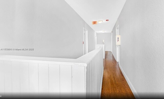 hall with dark wood-type flooring