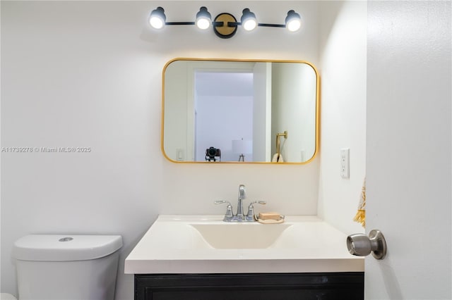 bathroom with vanity and toilet