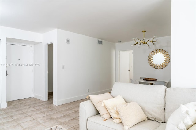 living room featuring an inviting chandelier