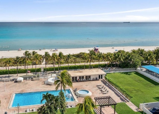 bird's eye view featuring a beach view and a water view