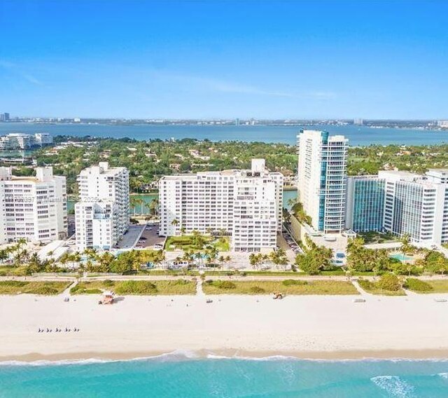 bird's eye view featuring a beach view and a water view