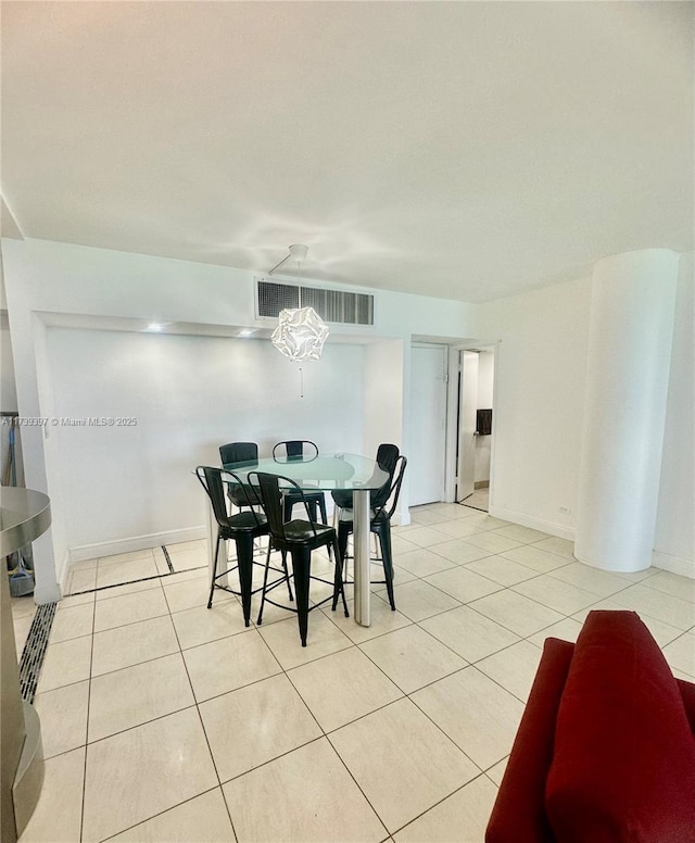 dining room featuring visible vents, baseboards, and light tile patterned floors