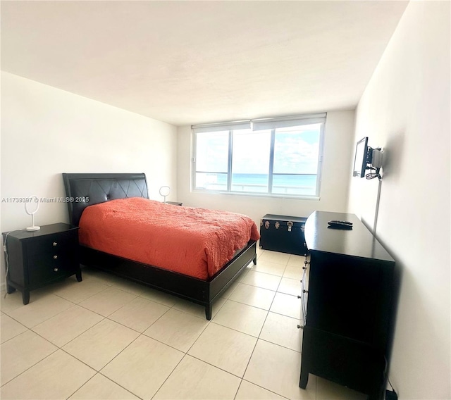 bedroom with light tile patterned floors