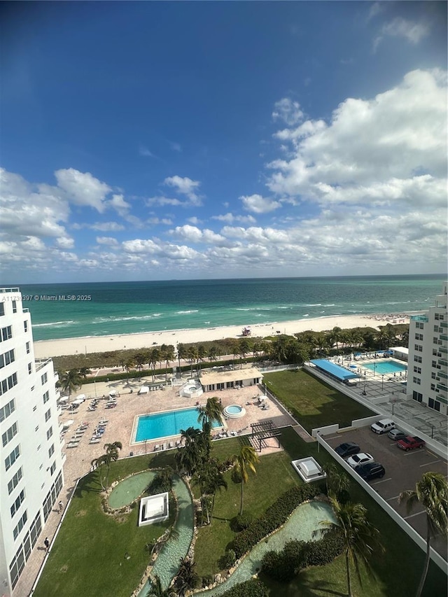 drone / aerial view with a water view and a view of the beach