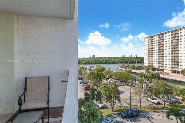 balcony featuring a water view