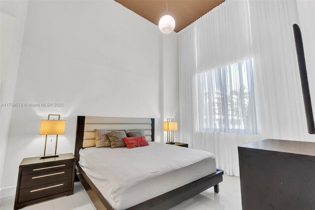 bedroom featuring light tile patterned floors