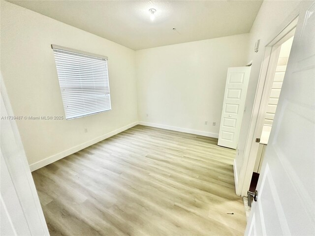 unfurnished bedroom with light hardwood / wood-style flooring