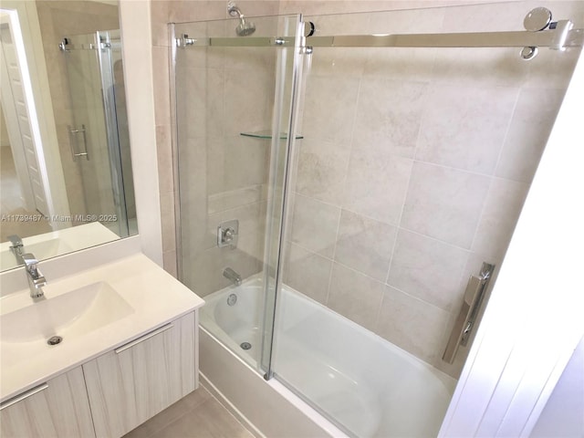 full bathroom with vanity and shower / bath combination with glass door