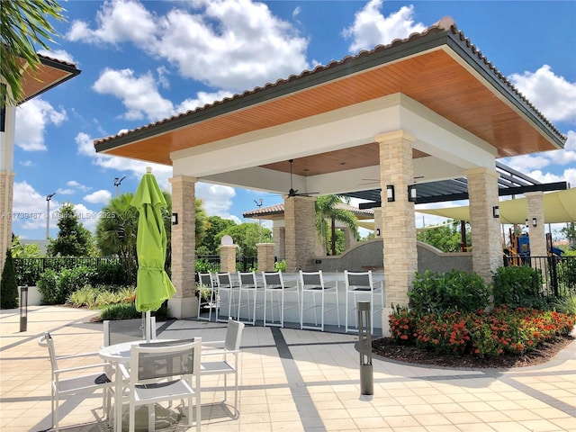 view of patio with fence and a gazebo