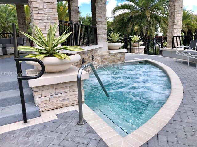 view of pool featuring a patio area