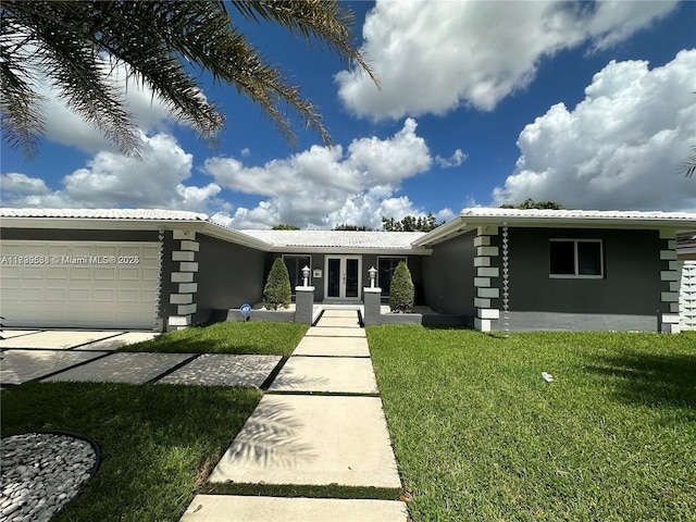 view of front facade featuring a garage and a front yard