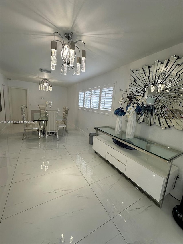 unfurnished dining area with an inviting chandelier