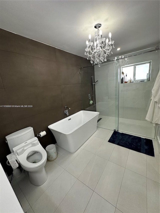 bathroom featuring tile walls, tile patterned flooring, an inviting chandelier, independent shower and bath, and toilet