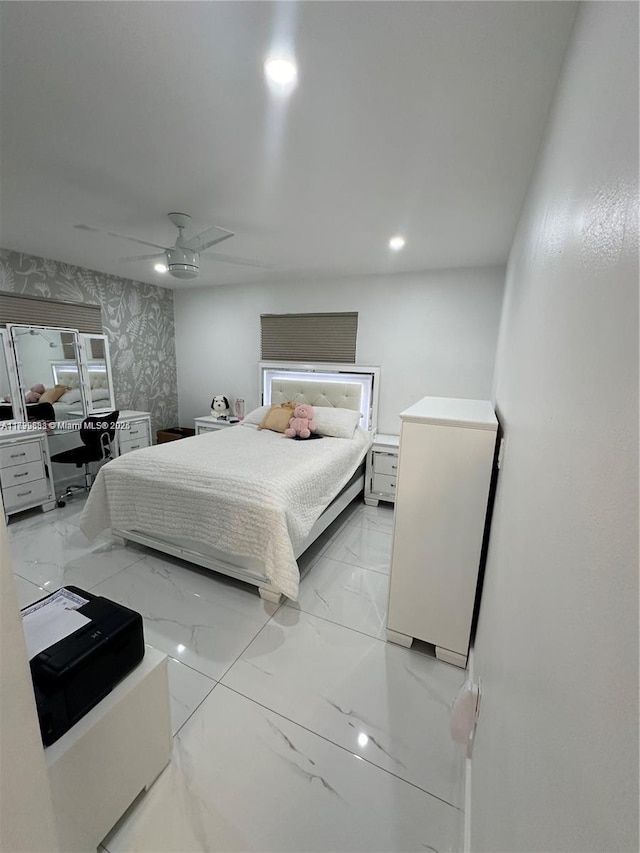 bedroom with ceiling fan and refrigerator