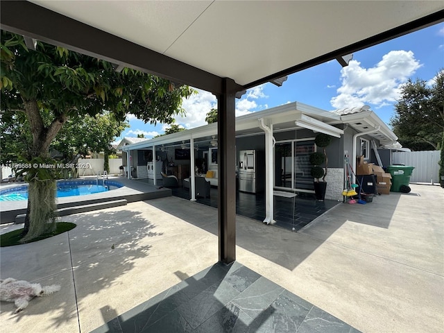 view of patio featuring a fenced in pool