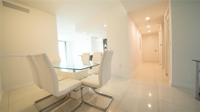 dining area with light tile patterned floors