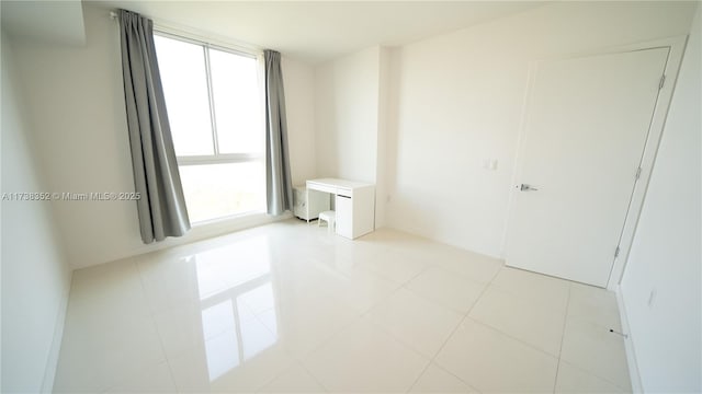 empty room with light tile patterned floors