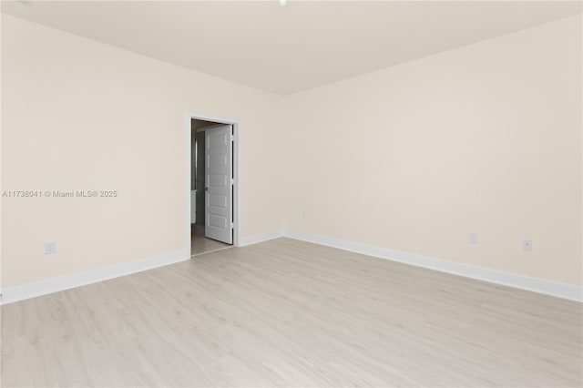 empty room with light hardwood / wood-style floors