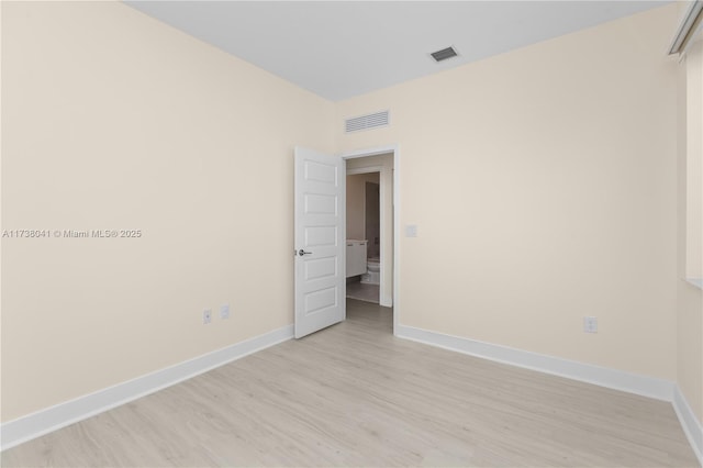 unfurnished room featuring light hardwood / wood-style flooring