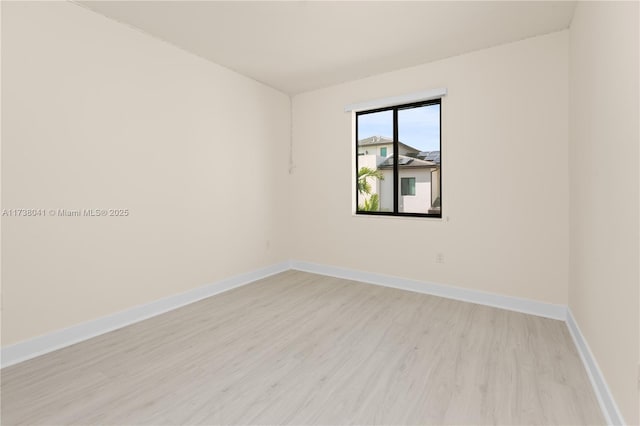 empty room with light hardwood / wood-style floors