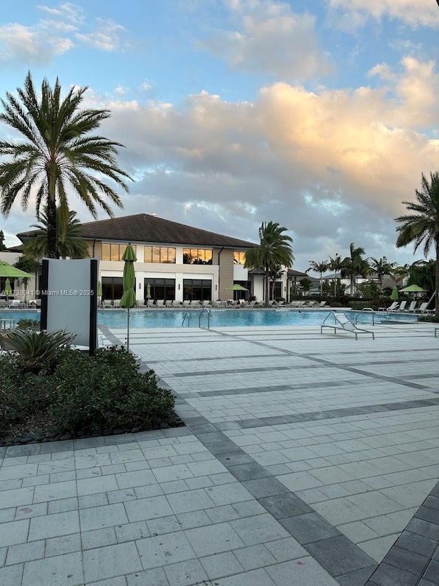 view of pool at dusk