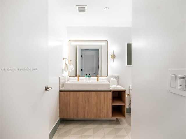 bathroom with vanity and tile patterned flooring