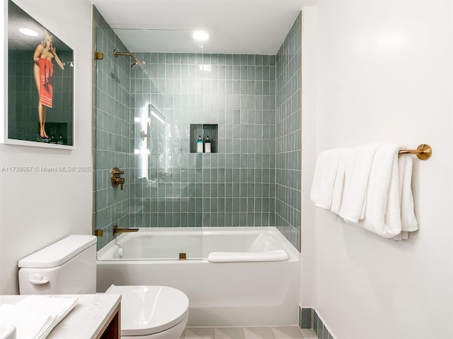 full bathroom featuring vanity, toilet, and tiled shower / bath