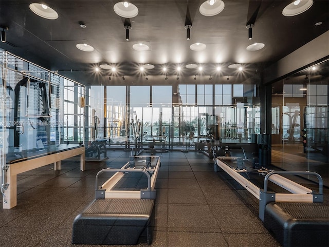 gym with floor to ceiling windows