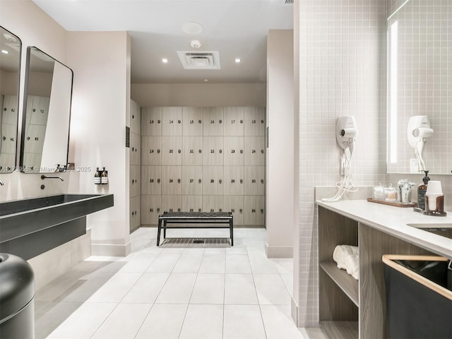 bathroom with vanity, tile patterned flooring, and mail boxes