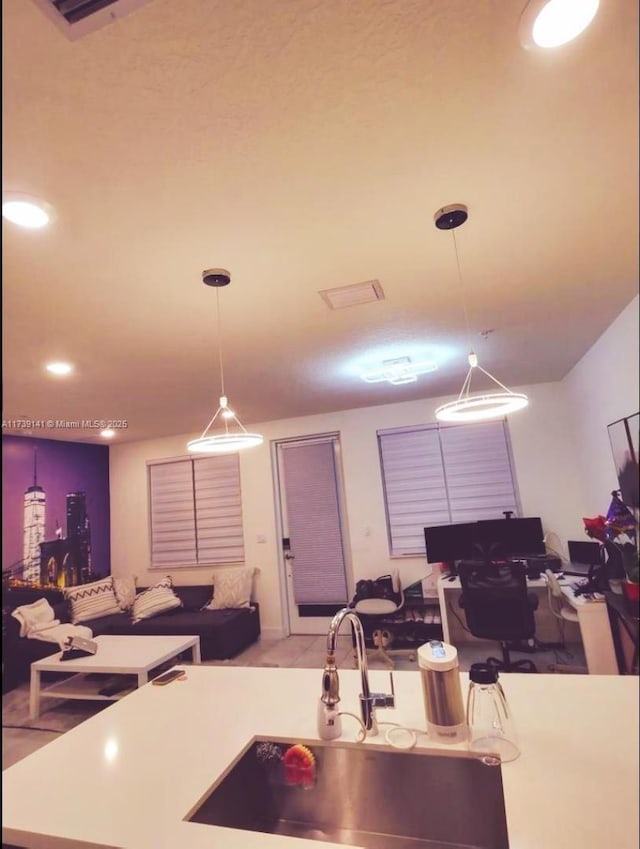 kitchen featuring sink and pendant lighting