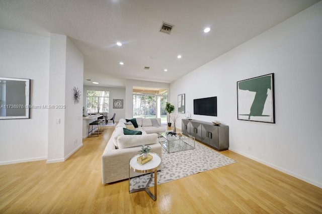 living room with light hardwood / wood-style floors