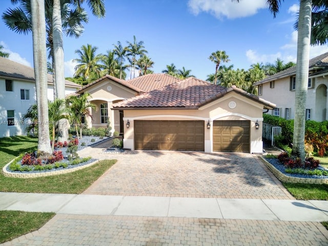 mediterranean / spanish house featuring a garage