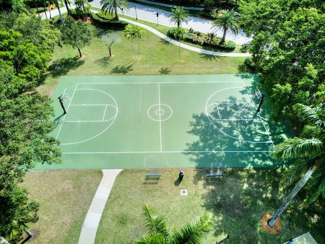 view of basketball court featuring a yard