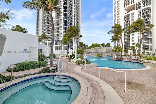 view of swimming pool featuring a patio area and pool water feature