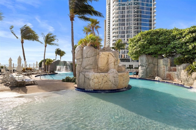 view of pool featuring pool water feature