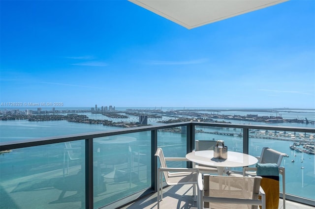 balcony featuring a water view