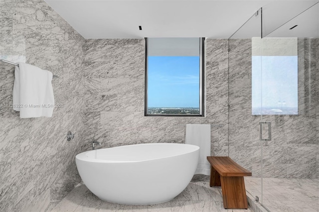 bathroom with separate shower and tub