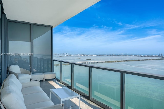 balcony featuring a water view