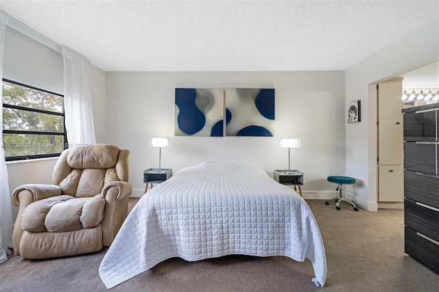 carpeted bedroom featuring a textured ceiling