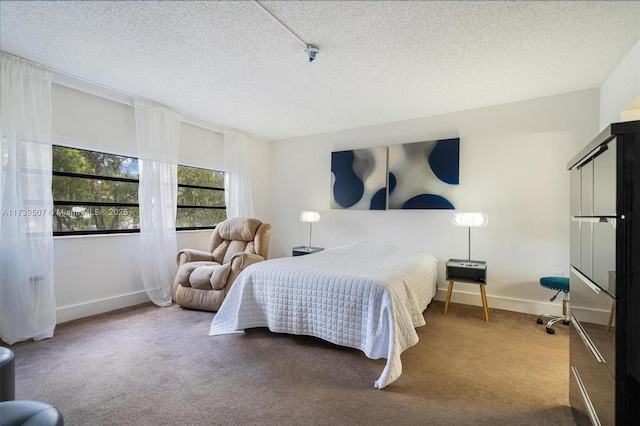 carpeted bedroom featuring a textured ceiling