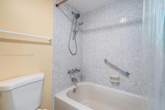 bathroom with shower / bath combination with curtain and toilet