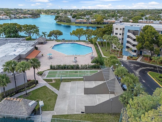 view of swimming pool featuring a water view