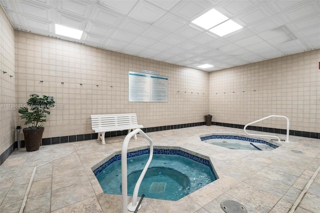 view of pool with an indoor in ground hot tub