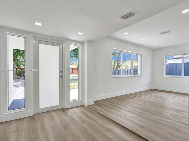 doorway with light hardwood / wood-style flooring