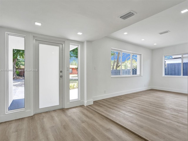 doorway to outside with light hardwood / wood-style floors